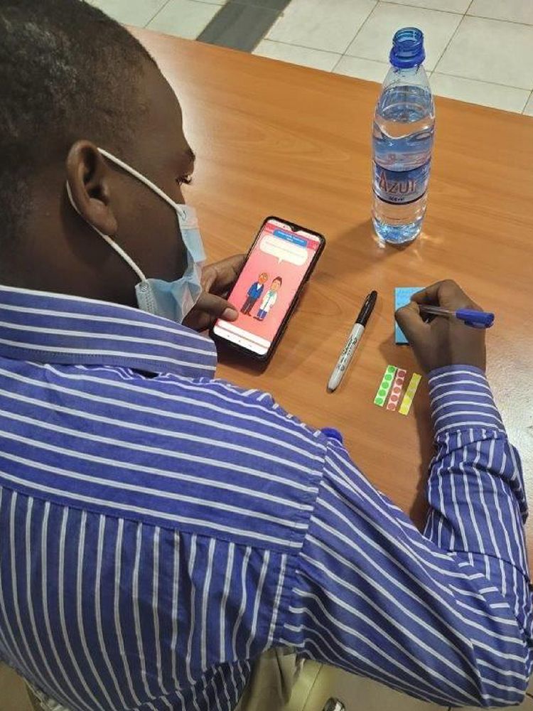 Uganda Co-Design Workshop participant tests the Cranky Uncle Vaccine game